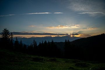 The first rays of sun in the morning on the mountains by chamois huntress