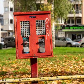 Red gumball machine by Christoph Müller