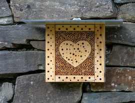 Wooden insect hotel with heart in the middle by ManfredFotos