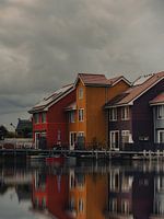Beautiful coloured houses on the water with reflection Reitdiephaven Groningen