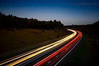 Traffic on a multiple lane highway through nature at night. by Sjoerd van der Wal Photography thumbnail