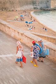 Three colourful ladies come from the beach by Wouter Kuin