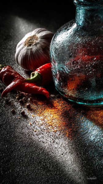 red peppers - garlic - lime - lemon on a black background with dramatic light by Gelissen Artworks