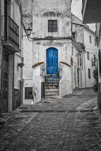 Blue door in the white town of Casares in Andalucia.