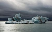 Ice Blocks and dark Clouds at the Jokulsarlon Lake, Iceland by Daan Kloeg thumbnail