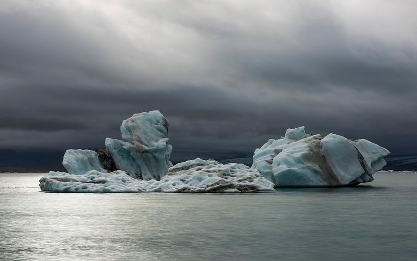 Ice Blocks and dark Clouds at the Jokulsarlon Lake, Iceland by Daan Kloeg