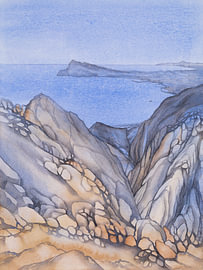 The serene, rocky coastal landscape on the Mediterranean