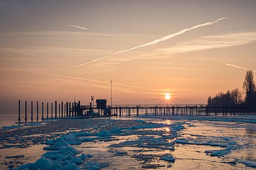 Sunrise at the pier Iznang Lake Constance in winter
