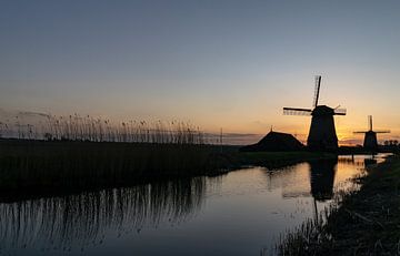 Les moulins du Schermerhorn au coucher du soleil sur Paul Veen