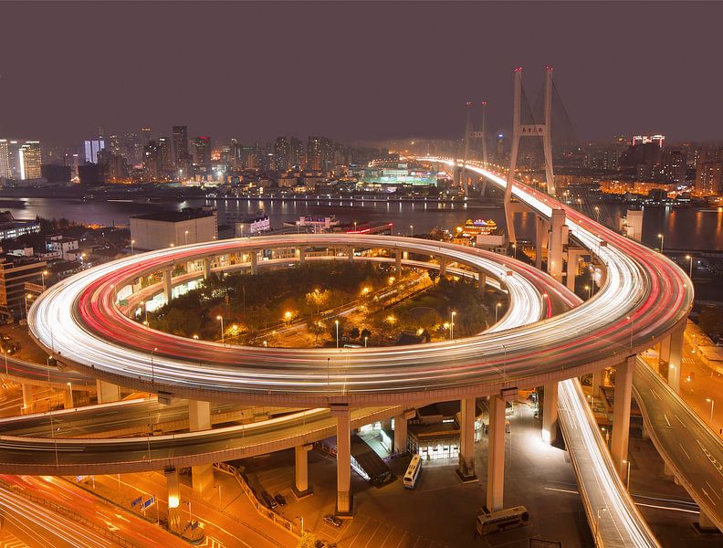 Shanghai Nanpu bridge over the Huangpu river at night  by Tony Vingerhoets