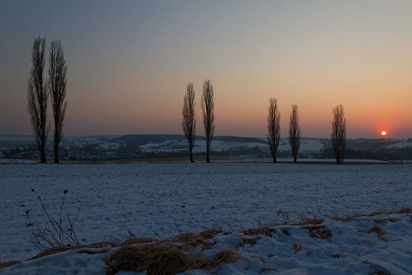 Een winterse zonsondergang van Maurice Hertog