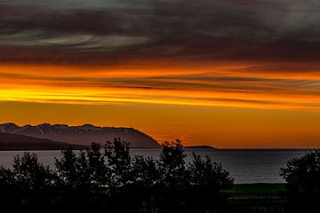 Orange evening sky in a fjord in Northern Iceland looking to the ocean by Hein Fleuren