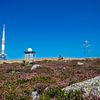 Contrast between human engineering and natural beauty with the Orange-White transmitter mast on the iconic Brocken by RAW & Refined