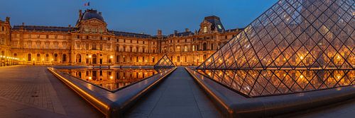 Louvre Museum reflected in the water