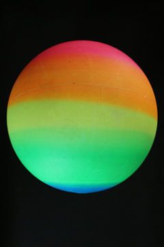Toy ball against black background