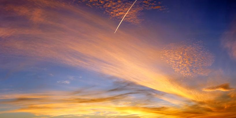Panorama of a beautiful orange sunset with contrail by MPfoto71