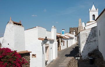 street with white houses and church in monsaraz  