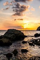 Rocks in the sea at colourful sunset