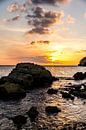 Rocks in the sea at colourful sunset by Joke Van Eeghem thumbnail