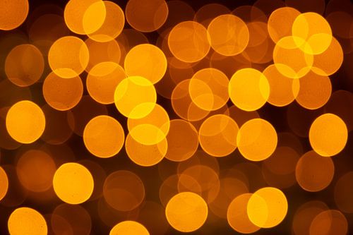 Bokeh van gouden feestlichtjes