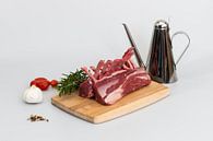 Rack of lamb with a few ingredients such as garlic, rosemary, peppercorns, tomatoes and olive oil by Wim Stolwerk thumbnail