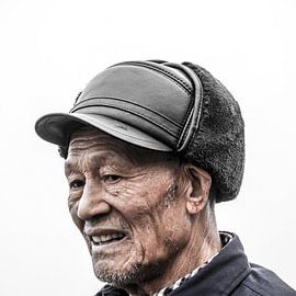 Chinese man with hat by Rob Bleijenberg