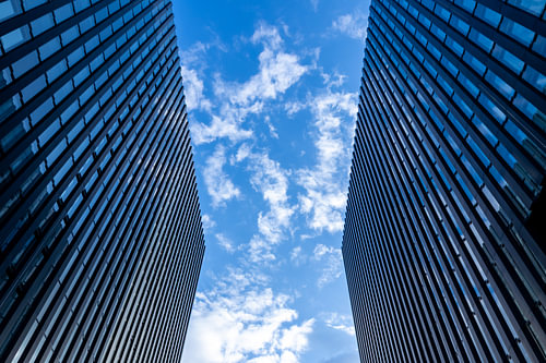 Skyscrapers against a sky of fair-weather clouds