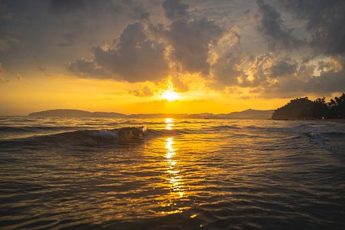 Beautiful sunset on the Aon Nang beach in Thailand.