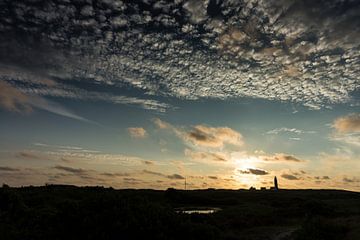 De ondergaande zon boven Texel sur Jan Peter Mulder