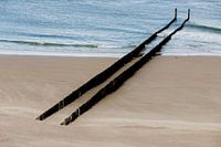 A deserted beach at Zoutelande with a row of breakwaters