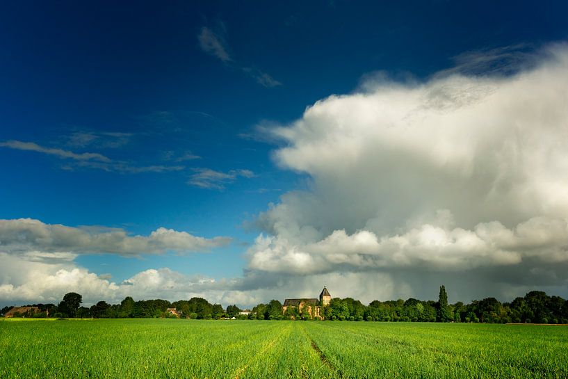 Rain showers above Dutch village by Bo Scheeringa Photography