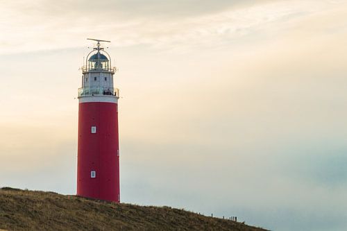 Lighthouse Texel in colorfull sky.