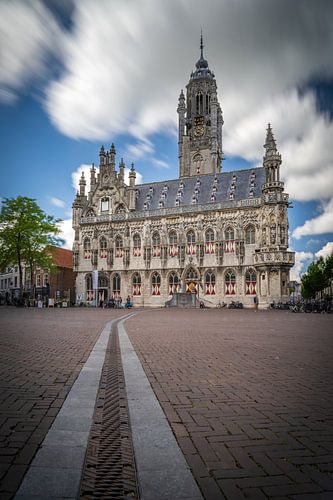 Middelburg town hall in Zeeland netherlands with beautiful clouds and people on the square