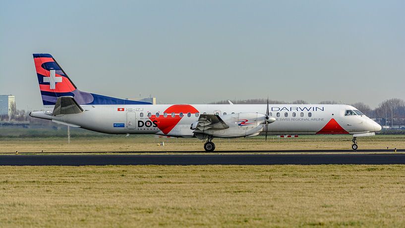 A Saab 2000 from Swiss has just landed on the Polderbaan runway and is taxiing to the terminal. by Jaap van den Berg