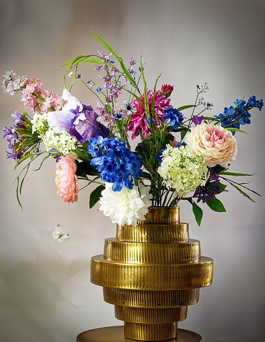 Still life: Golden vase with colorful bouquet of dried flowers