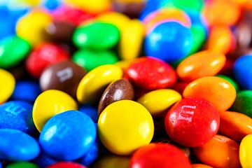 Colorful M&M candy coated button shaped milk chocolates