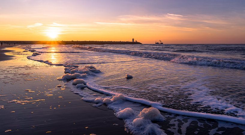 Sunset in the surf of Scheveningen by Chez Michel