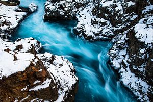 Clear blue water in winter Hraunfossar (Iceland) by Martijn Smeets