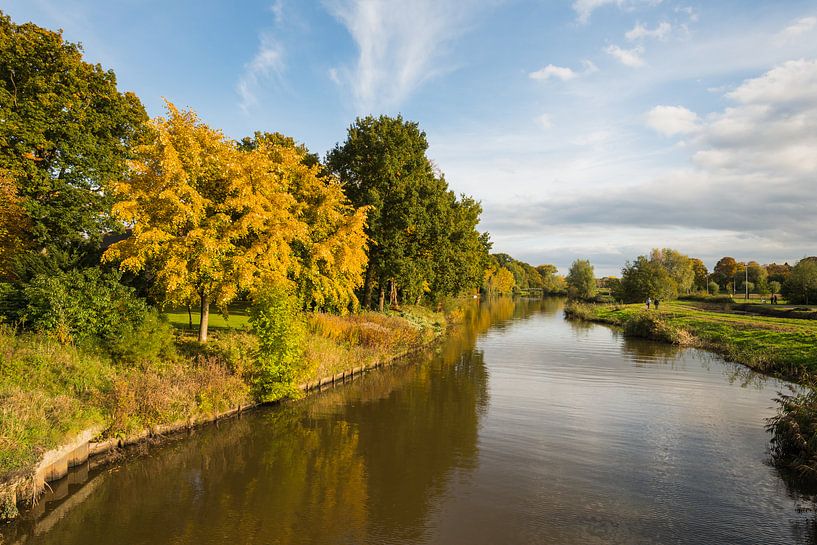 Narrow Dutch river in the autumn season by Ruud Morijn