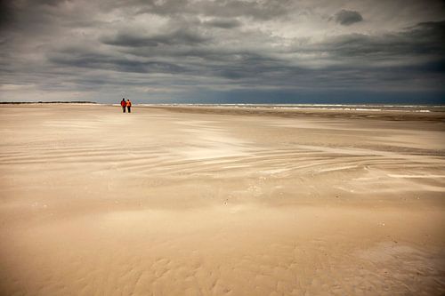 Thunderstorm atmosphere on the sandy beach of the island Spiekeroog by Peter Schickert