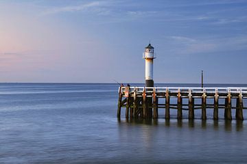 Light beacon on the pier by Rudi Everaert