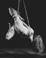 Naked woman tied up in bondage style with rope. #K0486