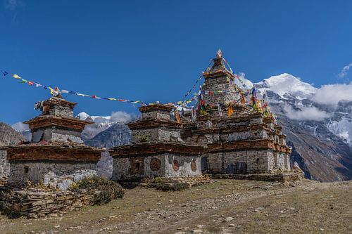 Pavement ash and prayer flag Nepal mountains