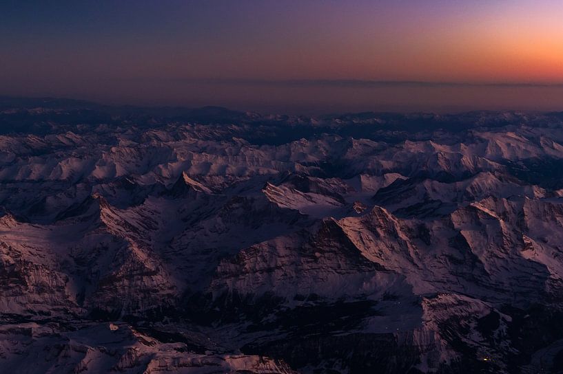 Aerial view over the Swiss Alps at sunset by Denis Feiner