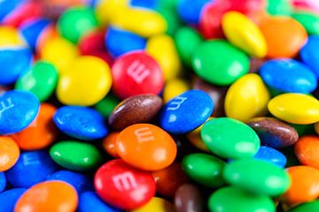 Colorful M&M candy coated button shaped milk chocolates by Sjoerd van der Wal