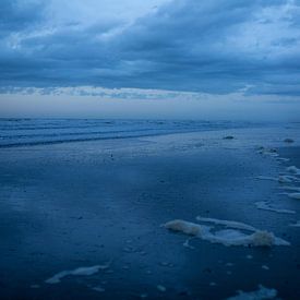 Lonely figure on the beach near Hoek van Holland by Studio Zwartlicht