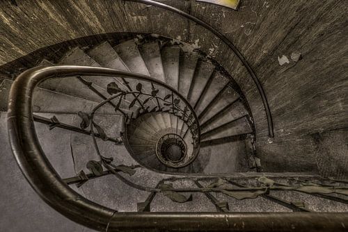 Stairwell in abandoned hotel by Kristel van de Laar