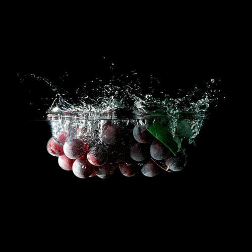 Grapes dipping into the water