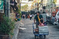 Locals buying food on the market by Stephan Smit thumbnail