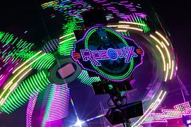 Rotor in a circle – a long-exposure shot of a fairground ride bathed in neon light by Mixed media vector arts